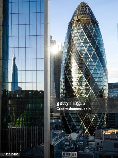 elevated view of futuristic financial buildings in london city - swiss re tower stock pictures, royalty-free photos & images