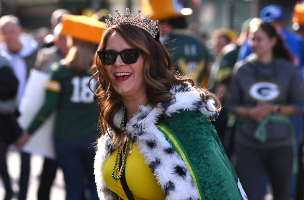 Female Green Bay Packers fan wearing a Packers cape and tiara pictured smiling prior to the NFL match between New York Giants and Green Bay Packers...