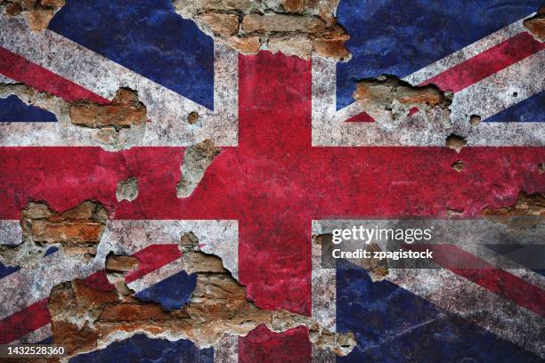 british flag on damaged wall - britische flagge stock-fotos und bilder
