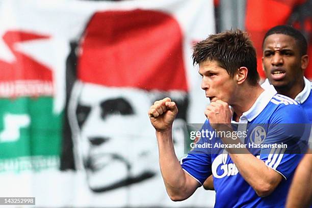 Klaas-Jan Huntelaar of Schalke celebrates scoring the first team goal with his team mate Jefferson Farfan during the Bundesliga match between FC...