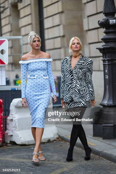 Guest wears a pale blue checkered print pattern with blue heart print pattern long sleeves / midi tube dress with white embroidered lace borders,...