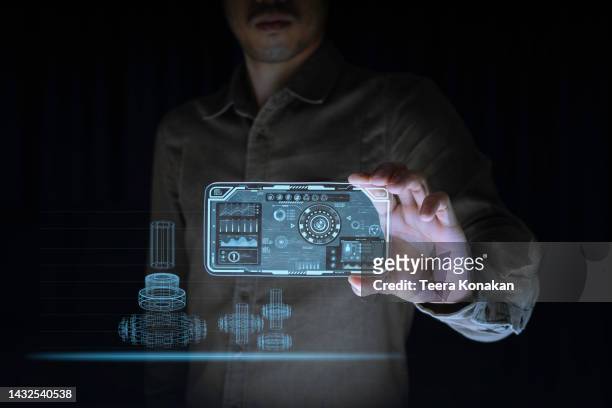 the engineer holds a virtual screen showing the robot setting information and monitors machine operation. - supporting functions for graphical user interface stockfoto's en -beelden