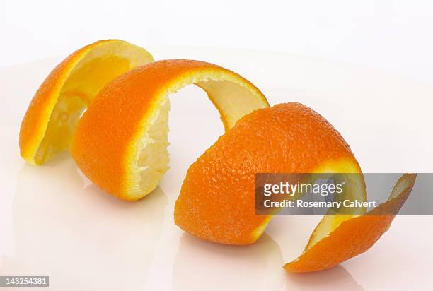 orange peel in a  coil - peel stock-fotos und bilder
