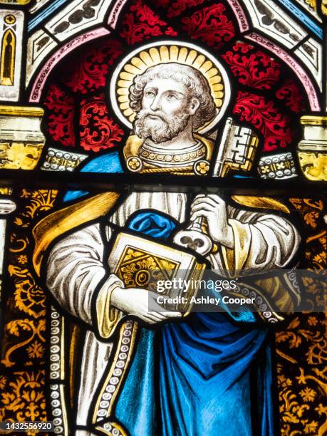st peter in a stained glass in downham church near clitheroe, lancashire, uk. - peter ashley stock pictures, royalty-free photos & images