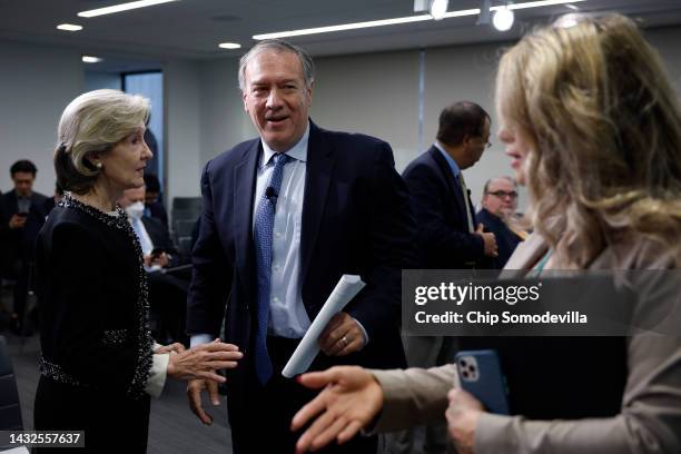 Former Secretary of State Mike Pompeo talks with former U.S. Permanent Representative to NATO Kay Bailey Hutchison during an event about "the growing...