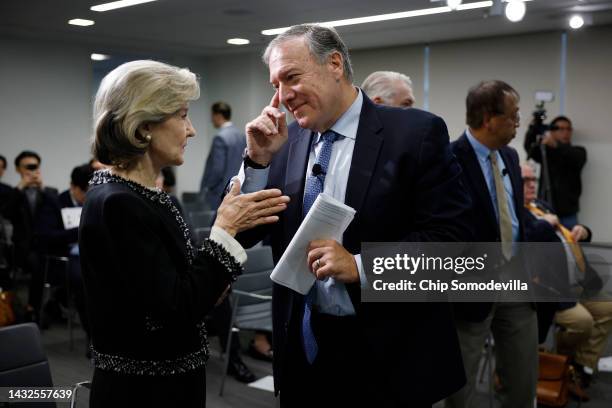 Former Secretary of State Mike Pompeo talks with former U.S. Permanent Representative to NATO Kay Bailey Hutchison during an event about "the growing...