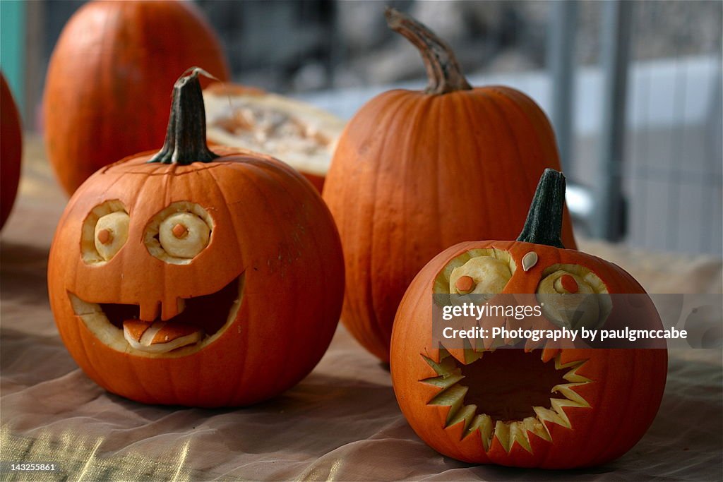 Pumpkins decorated with faces with eyes and mouths