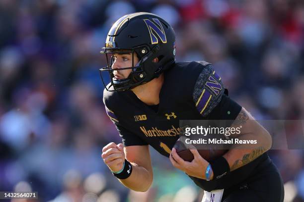 Brendan Sullivan of the Northwestern Wildcats runs with the ball against the Wisconsin Badgers during the first half at Ryan Field on October 08,...