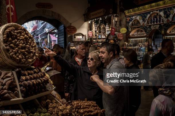 Tourists shop in Istanbul's famous Spice Bazaar on October 11, 2022 in Istanbul, Turkey. Turkey's inflation rate topped 83% last month according to...