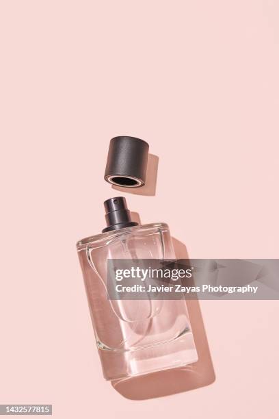 liquid sprayer on salmon background - perfume bildbanksfoton och bilder