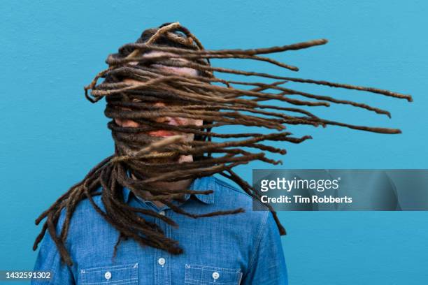 man with hair across his face - mens hair model stock pictures, royalty-free photos & images