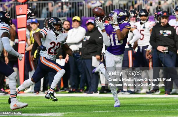 Minnesota Vikings wide receiver Justin Jefferson beats a pair of Chicago Bears defenders for a big catch during the second quarter of an NFL football...
