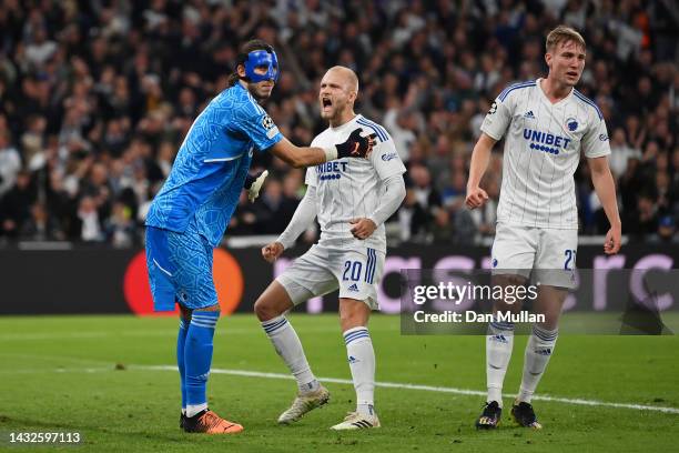 Kamil Grabara of FC Copenhagen celebrates with team mate Nicolai Boilesen of FC Copenhagen after saving a penalty during the UEFA Champions League...