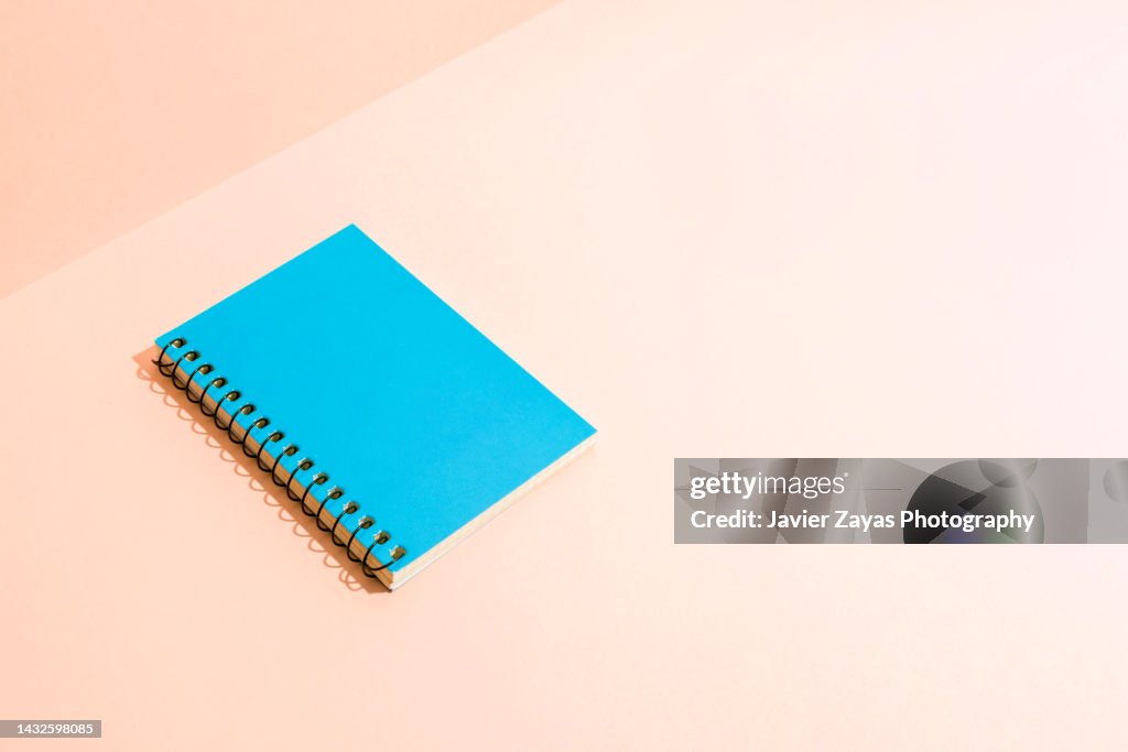 Blue Notepad On A Pastel Background High-Res Stock Photo - Getty Images