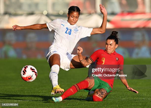 Sveindis Jonsdottir of Iceland battles for possession with Ana Borges of Portugal during the 2023 FIFA Women's World Cup play-off round 1 match...