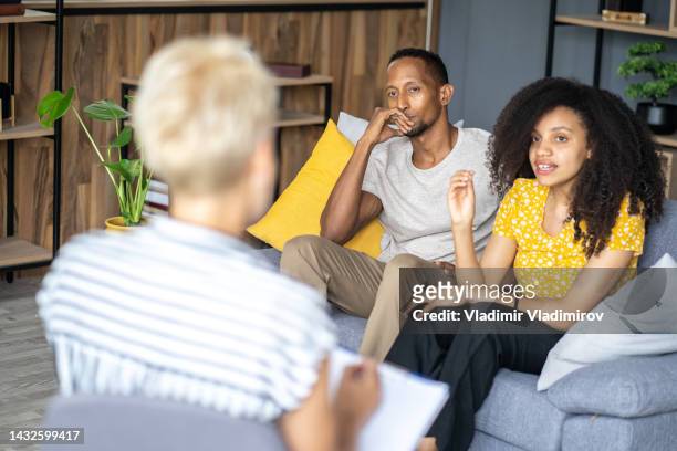 young couple in a marriage counselling session - married doctors stock pictures, royalty-free photos & images