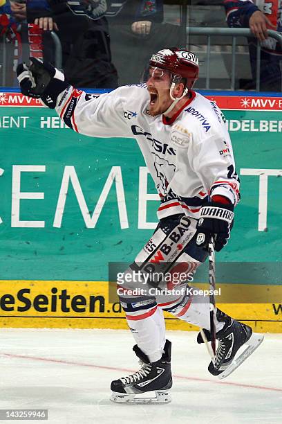 Travis James Mullock of Berlin celebrates the sixth and decision goal during the fourth DEL final match between Adler Mannheim an EHC Eisbaeren...