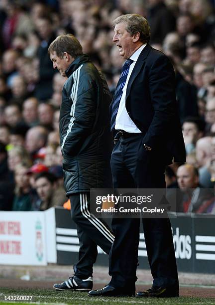 West Brom manager Roy Hodgson on the touchline alongside Liverpool manager Kenny Dalglish during the Barclays Premier League match between Liverpool...