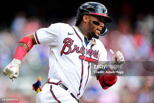 Ronald Acuna Jr. #13 of the Atlanta Braves runs the bases after hitting a double against the Philadelphia Phillies during the first inning in game...