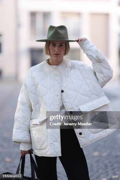 Victoria Thomas seen wearing Mads Norgard black pants, a hernameis Sweater, the Frankie Shop jacket, a Jacquemus bag and hat by Jacquemus on October...