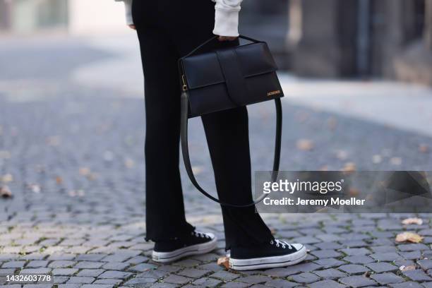 Victoria Thomas seen wearing Mads Norgard black pants, a hernameis Sweater, the Frankie Shop jacket and a Jacquemus bag on October 09, 2022 in...
