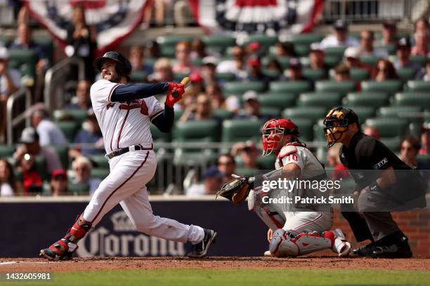 Travis d'Arnaud of the Atlanta Braves hits a home run against the Philadelphia Phillies during the second inning in game one of the National League...