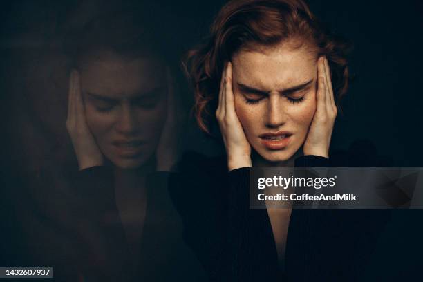 beautiful woman - woman head in hands sad stock pictures, royalty-free photos & images