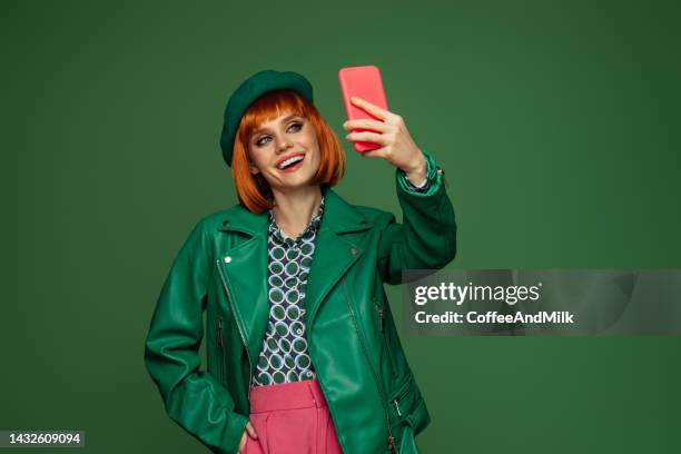 beautiful emotional woman using smartphone - glamour selfie stock pictures, royalty-free photos & images