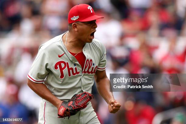 Ranger Suarez of the Philadelphia Phillies celebrates striking out Travis d'Arnaud of the Atlanta Braves while the bases are loaded during the third...