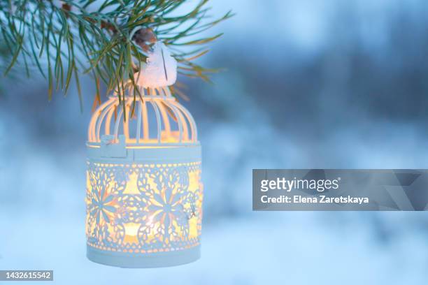 white lantern on a christmas tree - winter candlelight stock pictures, royalty-free photos & images