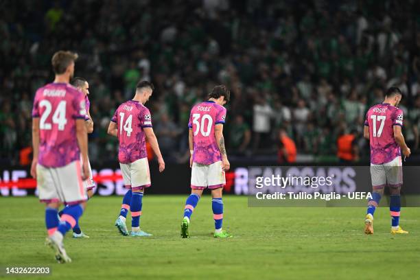 Arkadiusz Milik and Matias Soule of Juventus look dejected as they leave the field following their defeat during the UEFA Champions League group H...