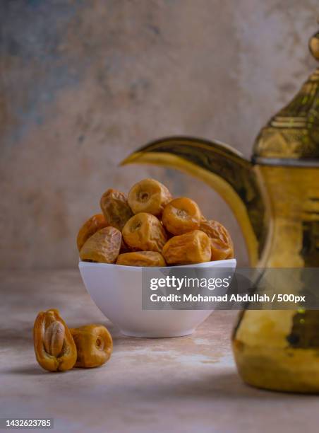 close-up of dates in bowl on table - date fruit stock pictures, royalty-free photos & images