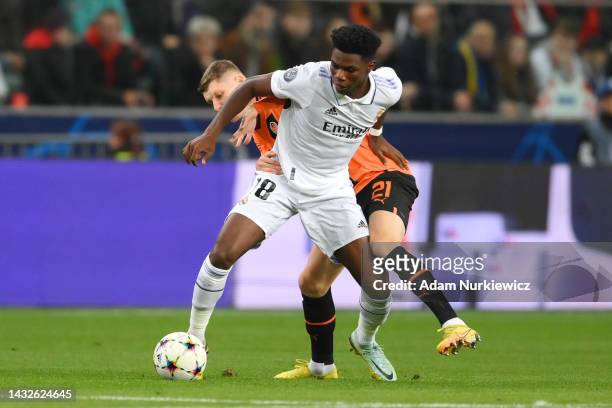 Aurelien Tchouameni of Real Madrid is challenged by Artem Bondarenko of Shakhtar Donetsk during the UEFA Champions League group F match between...