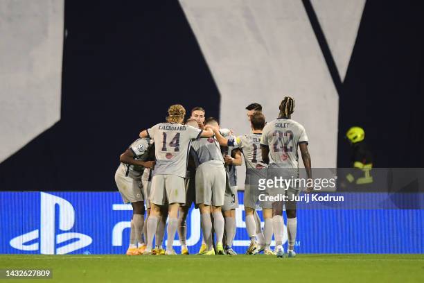 Nicolas Seiwald of FC Salzburg celebrates scoring their side's first goal with teammates during the UEFA Champions League group E match between...