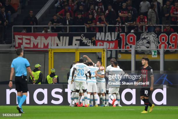 Jorginho of Chelsea celebrates with teammates after scoring their team's first goal from the penalty spot during the UEFA Champions League group E...