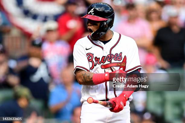 Orlando Arcia of the Atlanta Braves celebrates after a walk against the Philadelphia Phillies during the fifth inning in game one of the National...