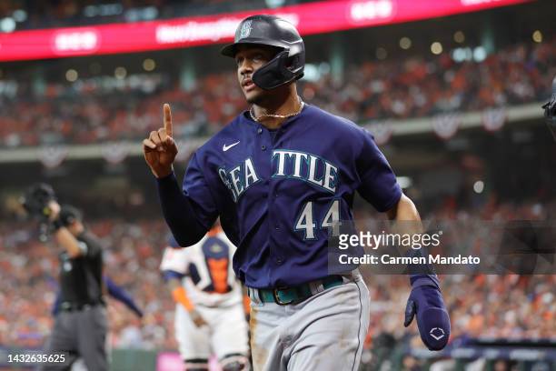 Julio Rodriguez of the Seattle Mariners reacts after scoring a run against the Houston Astros during the first inning in game one of the American...