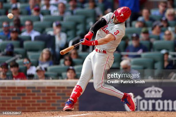 Bryce Harper of the Philadelphia Phillies hits a double against the Atlanta Braves during the sixth inning in game one of the National League...