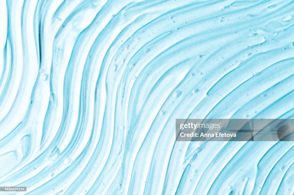 Textured gel with air bubbles. Concept of skincare and beauty. Backdrop for your design. Flat lay style. Care cosmetics with peptides, ceramides, retinol molecules concept. Oil or hyaluronic or polyglutamic acid