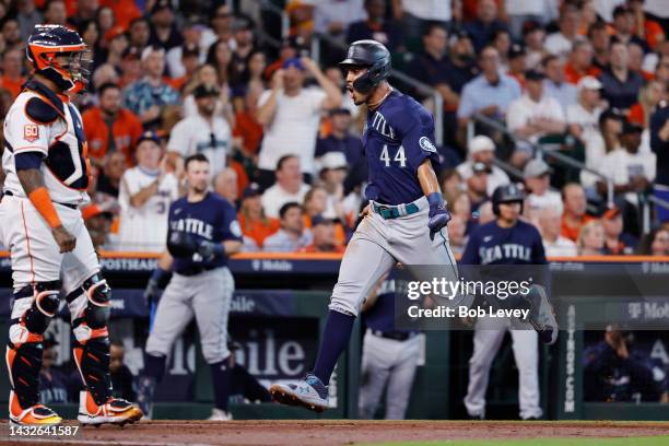 Julio Rodriguez of the Seattle Mariners scores a run against the Houston Astros during the second inning in game one of the American League Division...
