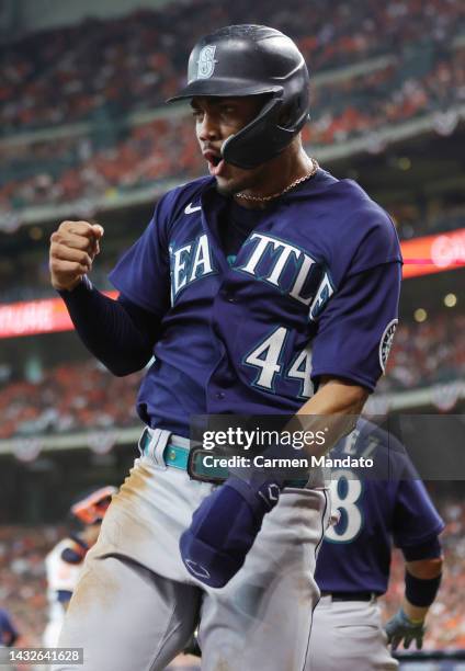 Julio Rodriguez of the Seattle Mariners reacts after scoring a run against the Houston Astros during the second inning in game one of the American...