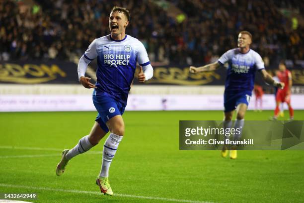 Nathan Broadhead of Wigan Athletic celebrates after scoring their sides first goal during the Sky Bet Championship between Wigan Athletic and...