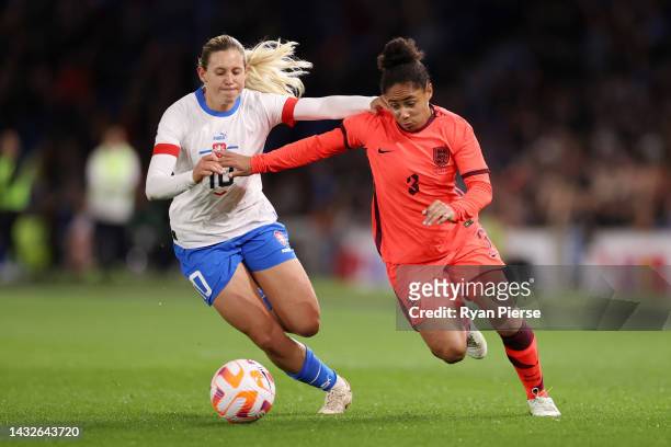 Katerina Svitkova of Czech Republic battles for possession with Demi Stokes of England during the International Friendly match between England and...