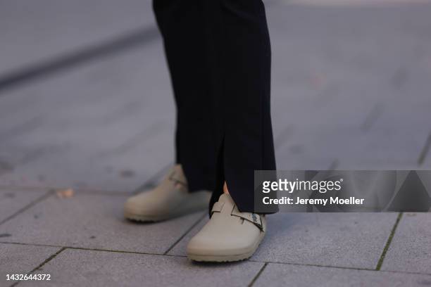 Victoria Thomas seen wearing Birkenstock shoes and H&M pants on October 09, 2022 in Cologne, Germany.