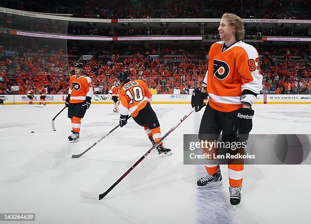 Jakub Voracek, Brayden Schenn and Eric Wellwood of the Philadelphia Flyers warm up prior to their game against the Pittsburgh Penguins in Game Four...