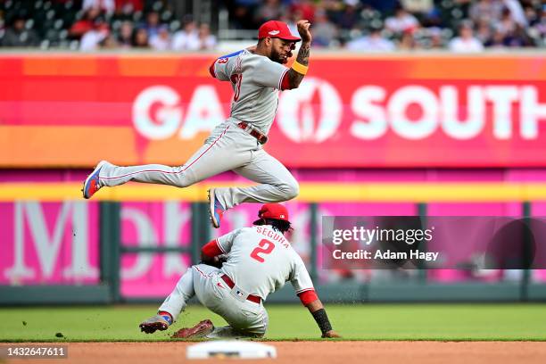 Jean Segura of the Philadelphia Phillies fields a ground ball against the Atlanta Braves during the ninth inning in game one of the National League...