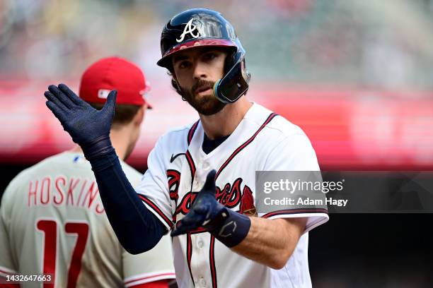 Dansby Swanson of the Atlanta Braves reacts after a hit against the Philadelphia Phillies during the ninth inning in game one of the National League...