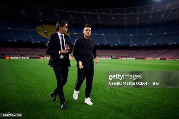 Lautaro Martinez of FC Internazionale and Head Coach Simone Inzaghi of FC Internazionale players inspect the pitch ahead of their UEFA Champions...