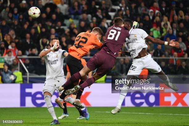 Antonio Rudiger of Real Madrid clashes with Anatoliy Trubin of Shakhtar Donetsk during the UEFA Champions League group F match between Shakhtar...