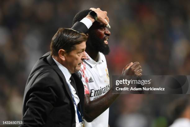 Antonio Rudiger of Real Madrid is seen injured after clashing with Anatoliy Trubin of Shakhtar Donetsk during the UEFA Champions League group F match...